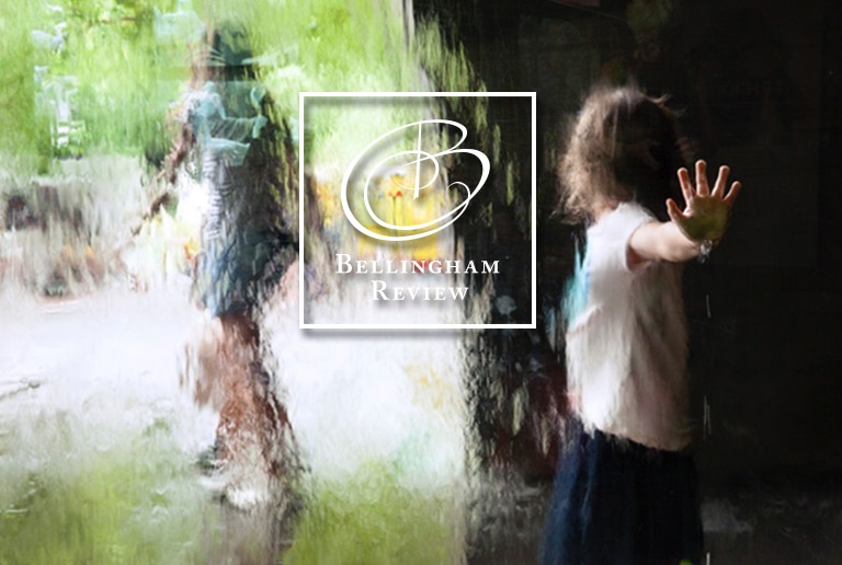 Issue 77 Cover: A photograph of a child pressing their hand against water falling down a window. The child's hand is in focus, the rest of the image is blurred by the water.