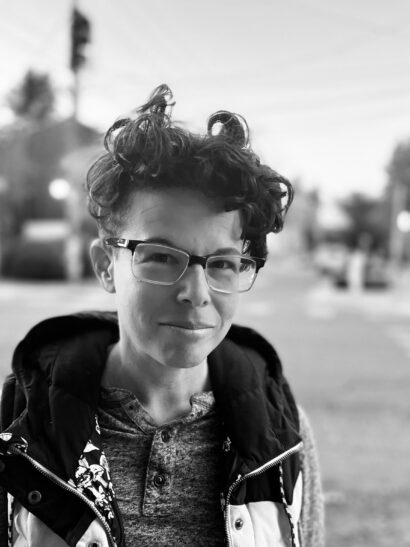 Writer Dani Blackman in a black and white image wearing glasses.