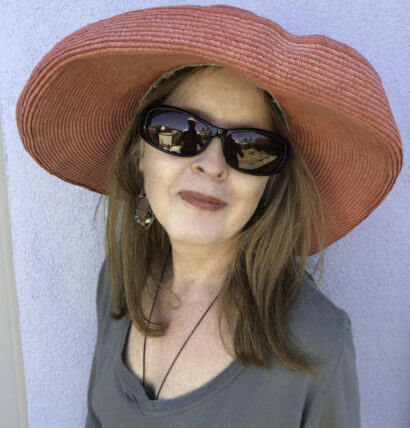 Writer Susan Nordmark in a mauve sun hat