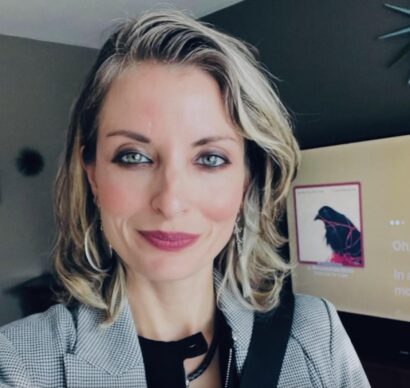 Author Jessica Lowell Mason, a woman with blonde hair and light pink lipstick, smiles slightly at the camera