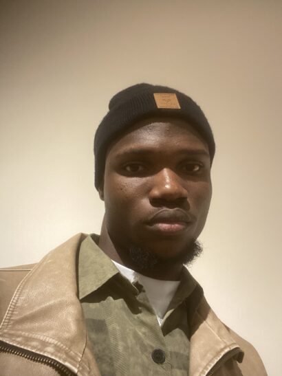 Author Prosper Ifeanyi looks into the camera with a serious expression