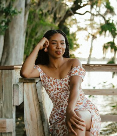 Kianna in a floral dress in the sun